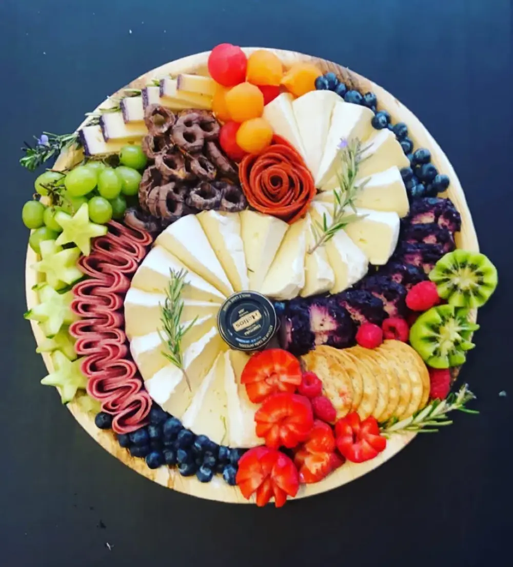 Circle shaped charcuterie with meats, cheese and fruit