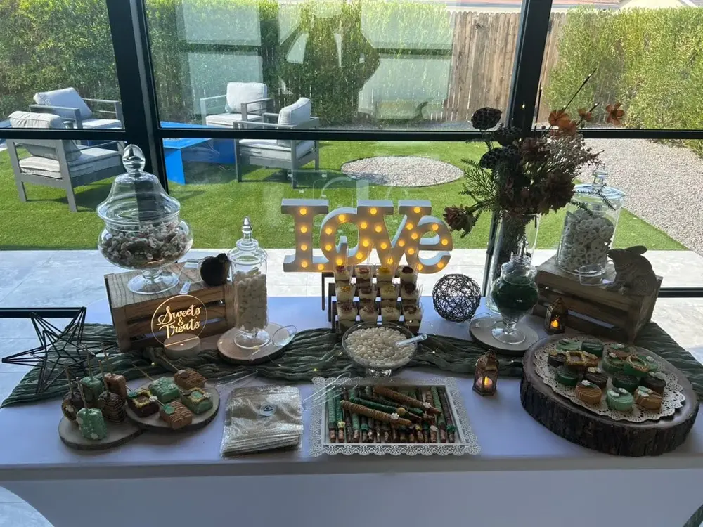 Enchanted forest bridal party themed green and gold candy buffet
